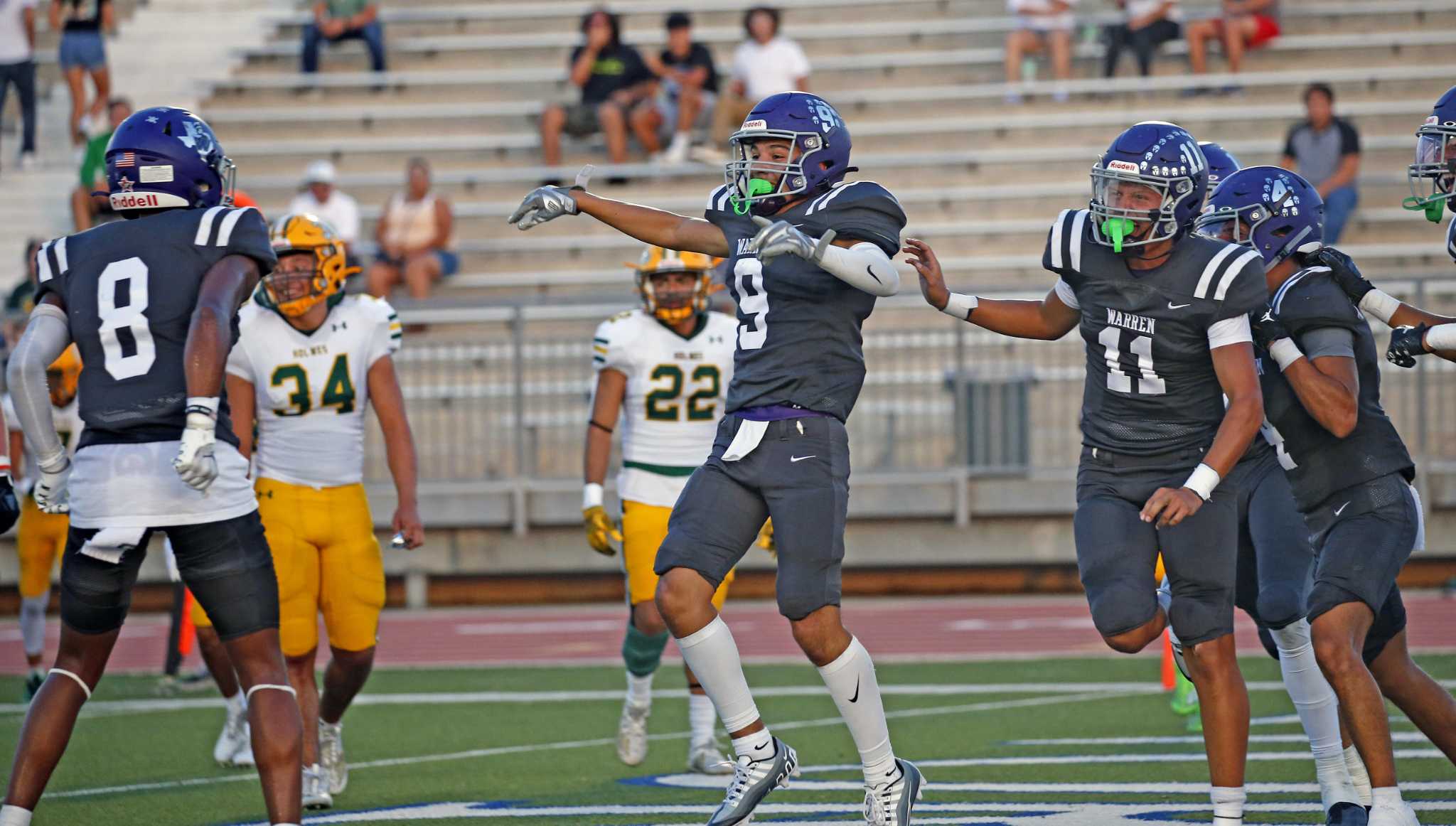 High school football Warren 63, Holmes 0