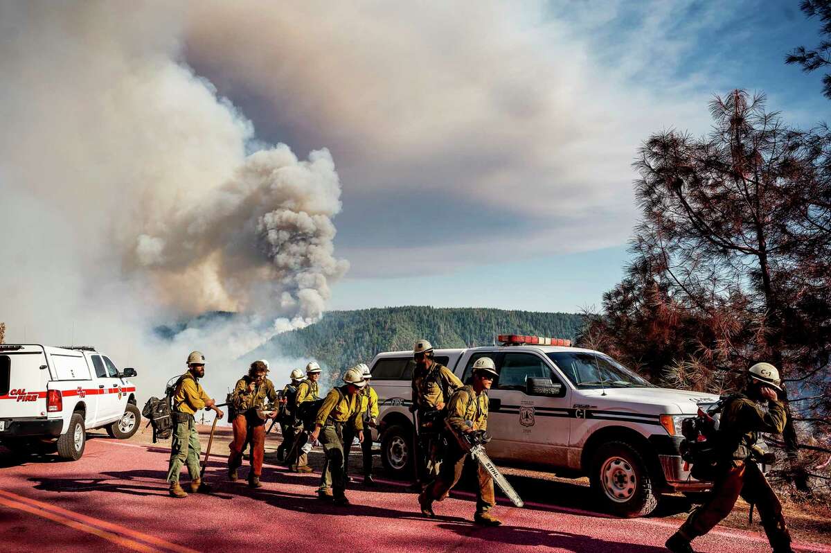 A hand crew prepares to battle the Mosquito Fire along Mosquito Ridge Rd. near the Foresthill community in Placer County, Calif., on Thursday, Sept. 8, 2022.