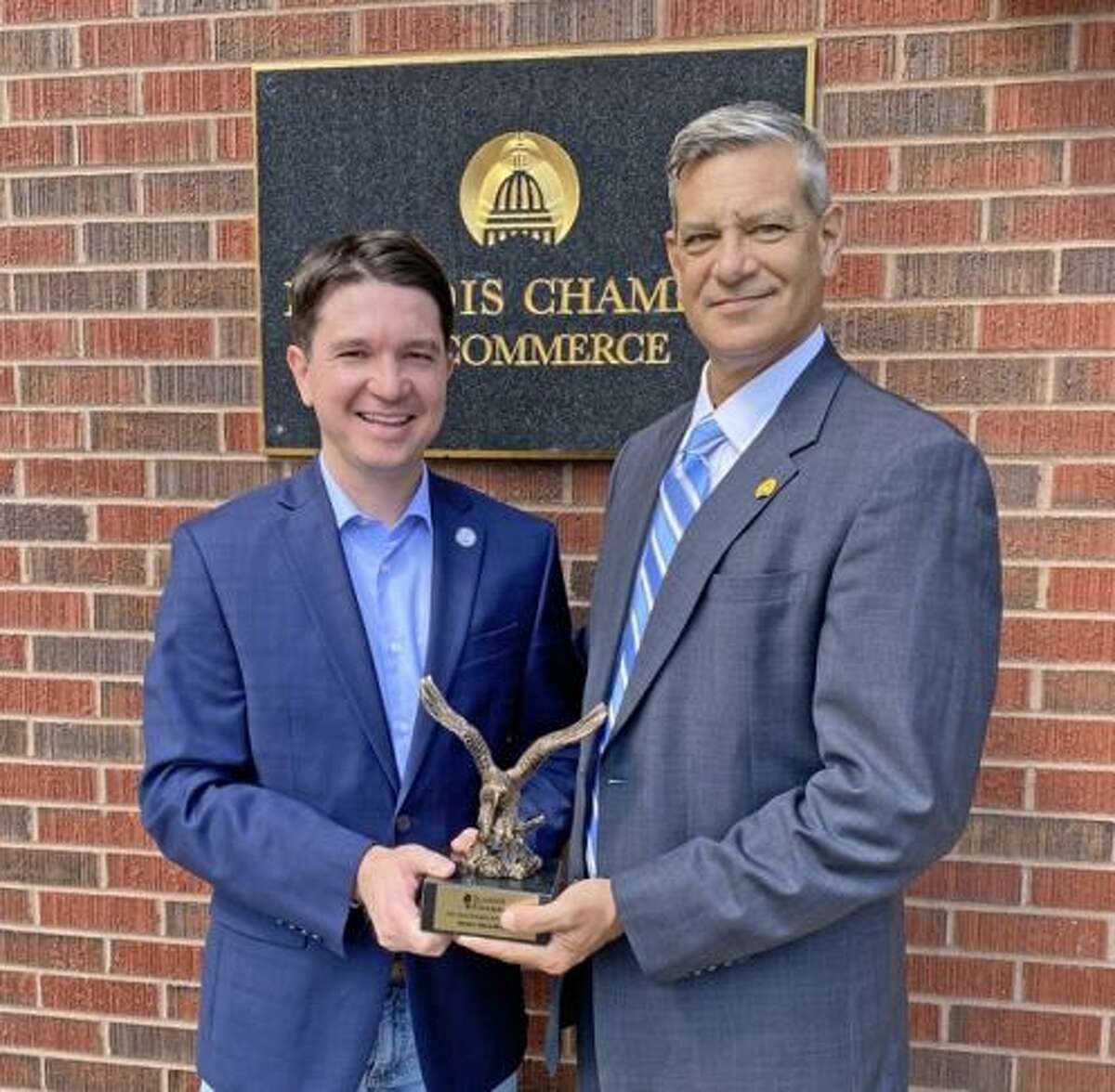 State Sen. Steve McClure, left, accepts the “Champion of Free Enterprise” award from Illinois Chamber of Commerce President and CEO Todd Maisch.