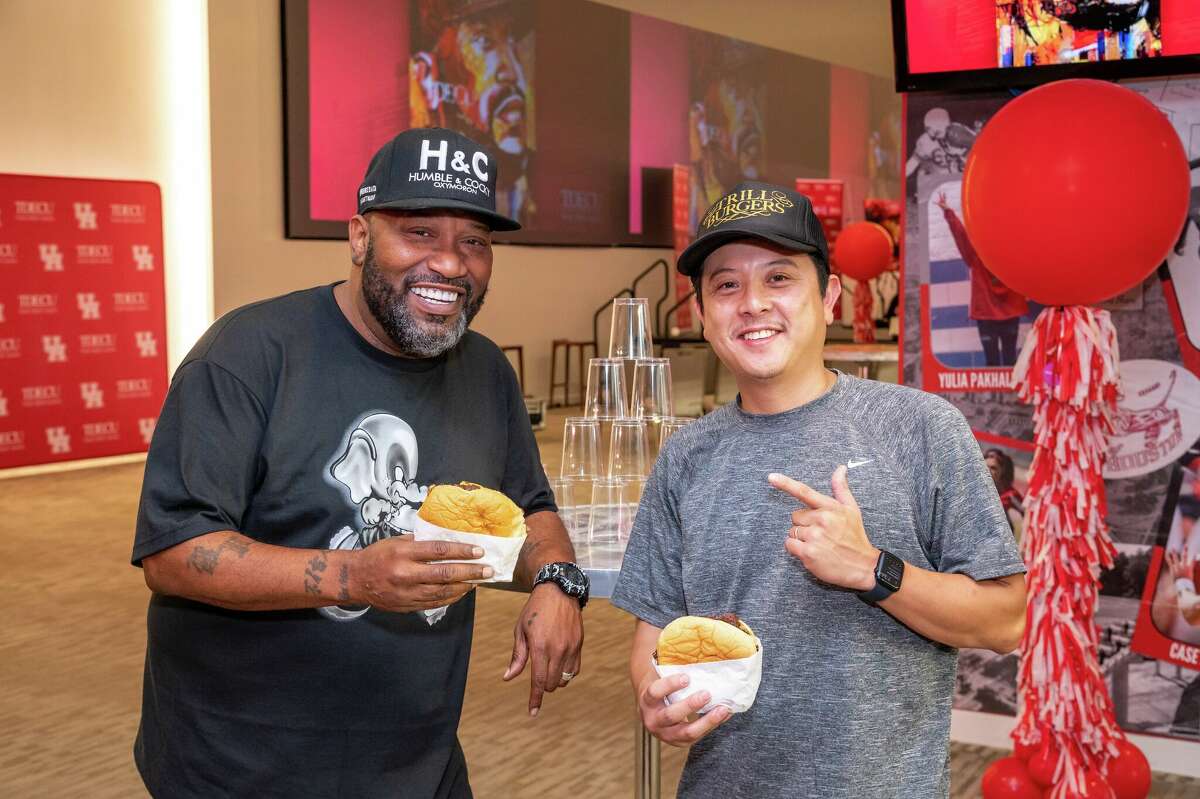 Bun B and chef Mike Pham show off their Trill Burgers at an event at University of Houston's TDECU Stadium on Thursday, Sept. 8, 2022.