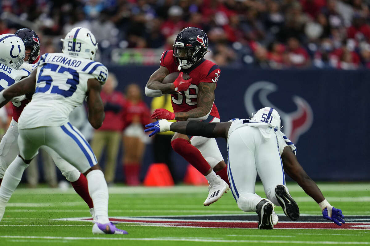 HOUSTON, TEXAS - DECEMBER 05: Shyheim Carter #38 of the Houston Texans runs the ball against the Indianapolis Colts during an NFL game at NRG Stadium on December 05, 2021 in Houston, Texas. (Photo by Cooper Neill/Getty Images)