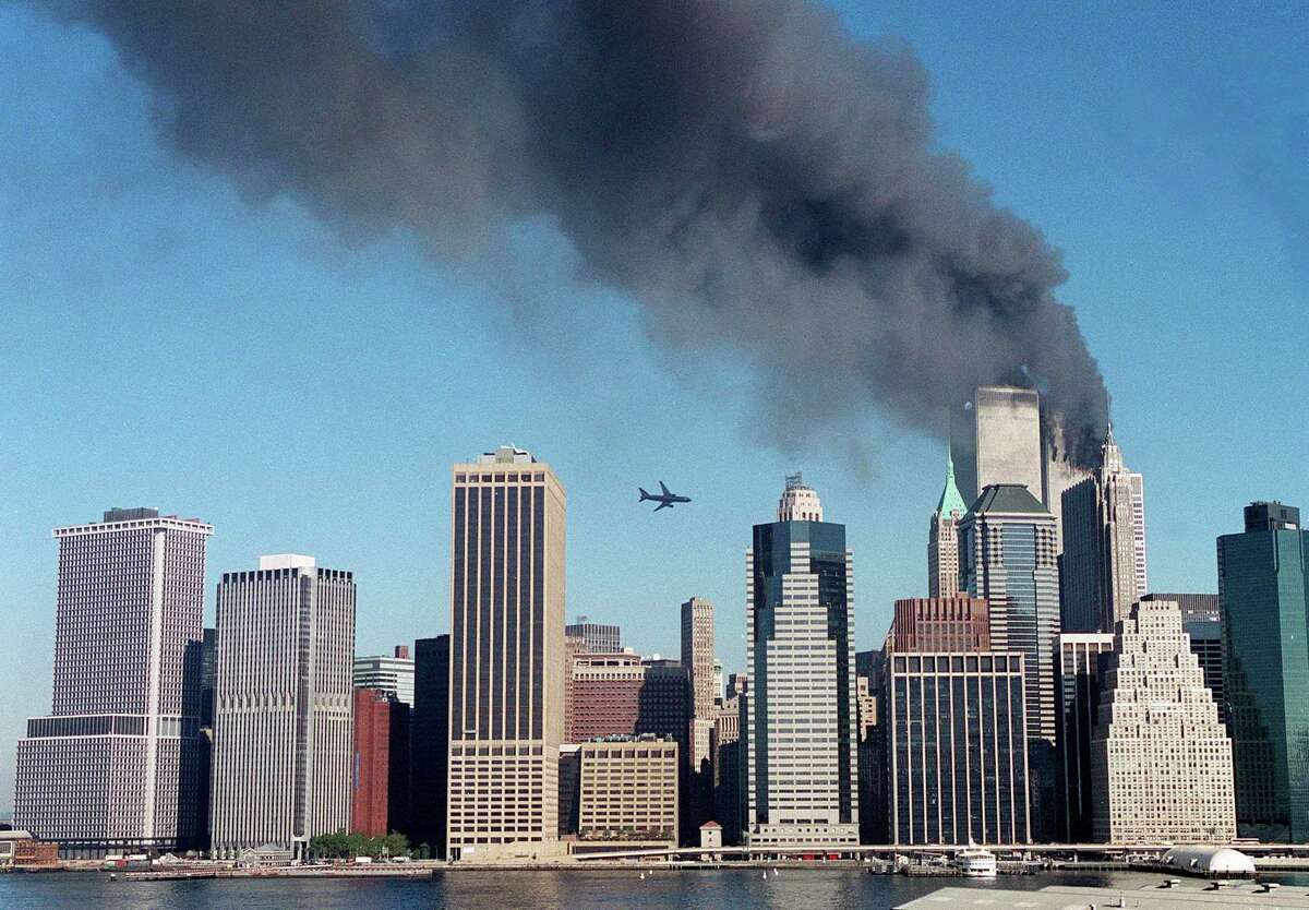 United Airlines Flight 175 approaches the South Tower of the World Trade Center in New York as the North Tower burns. The attack shook the world, and dramatically changed our nation.