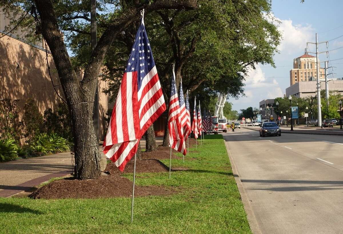 American flags line the side of the Beaumont Civic Center in recognition of local first responders. Photo taken Sept. 8, 2022. Photo by Olivia Malick/ The Enterprise