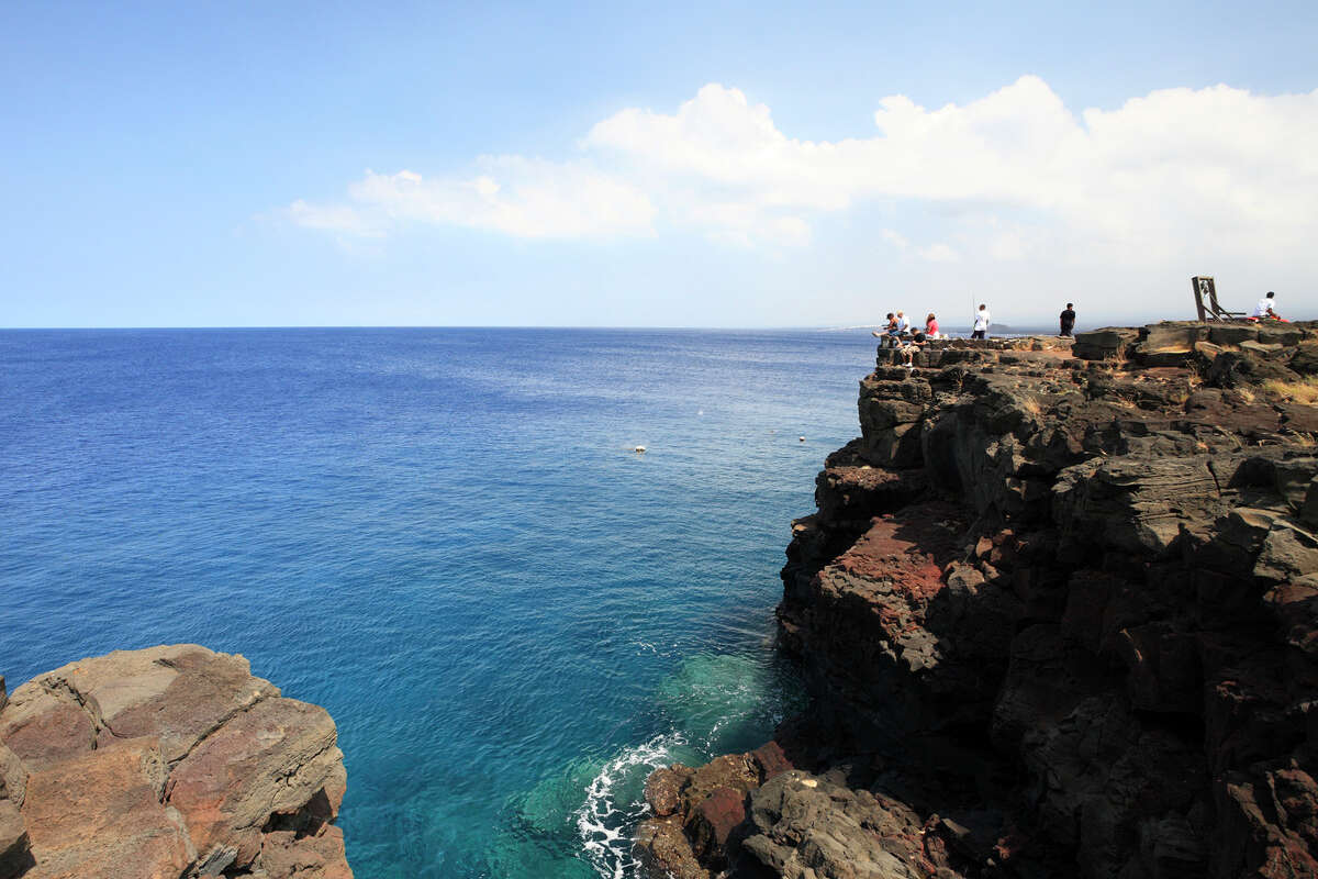 People gather at Ka Lae to see the southernmost point of the U.S., fish and dive.