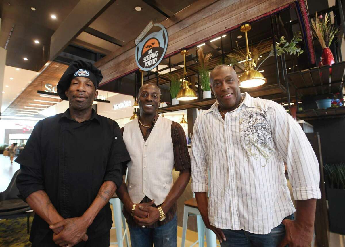From left, chef Bion “BG” Green, founder and owner Har’rell Chisolm and franchisee Darrell Tyson gather at the new The Sleeping Potato at The SoNo Collection in Norwalk, Conn. on Tuesday, Sept. 6, 2022.