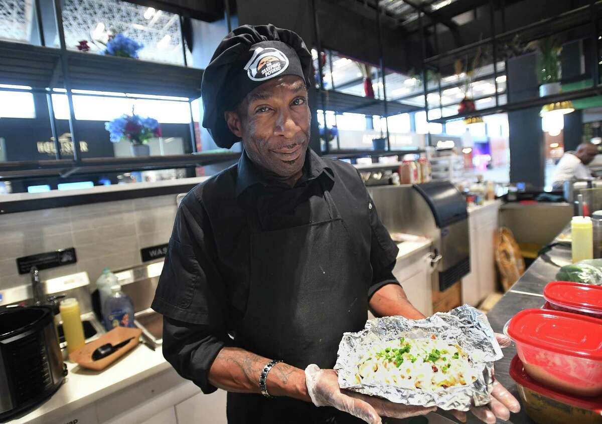 Chef Bion “BG” Green creates specialty stuffed potatoes at the new The Sleeping Potato at The SoNo Collection in Norwalk, Conn., on Tuesday, Sept. 6, 2022.