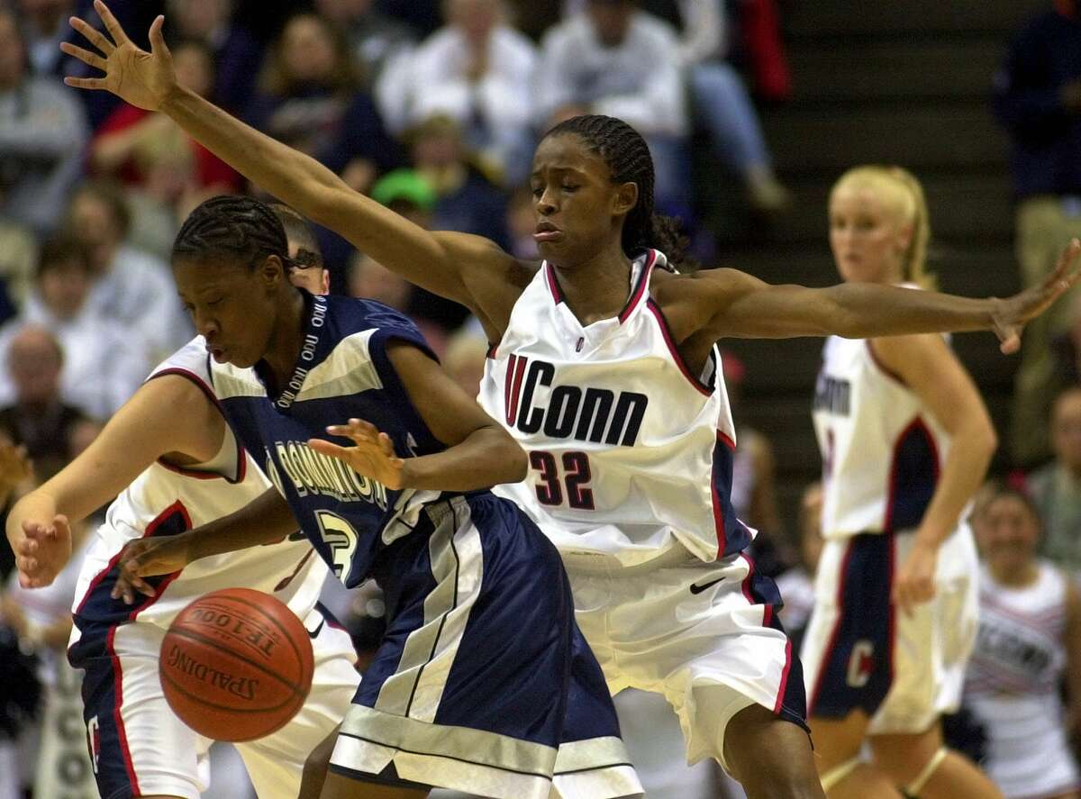 Connecticut's Swin Cash guards Old Dominion's Sharron Francis as Francis tried to bring the ball in during the first half in Storrs, Conn., Thursday, Jan. 18, 2001. 