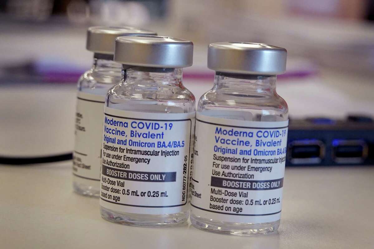 A pharmacist prepares to administer COVID-19 vaccine booster shots during an event hosted by the Chicago Department of Public Health in Chicago, Ill.