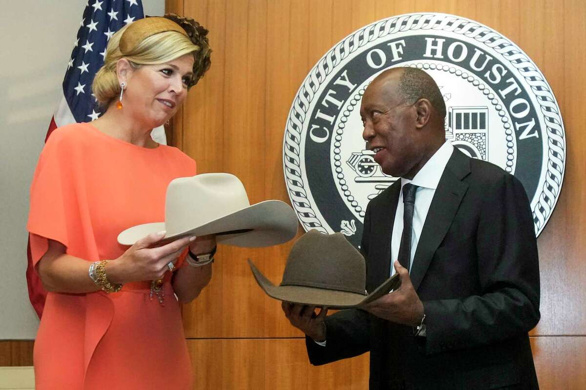 Houston Mayor Sylvester Turner presents Queen Maxima of the Netherlands with a pair of cowboy hats during a welcoming ceremony at City Hall on Friday, Sept. 9, 2022 in Houston. (Brett Coomer/Houston Chronicle via AP)