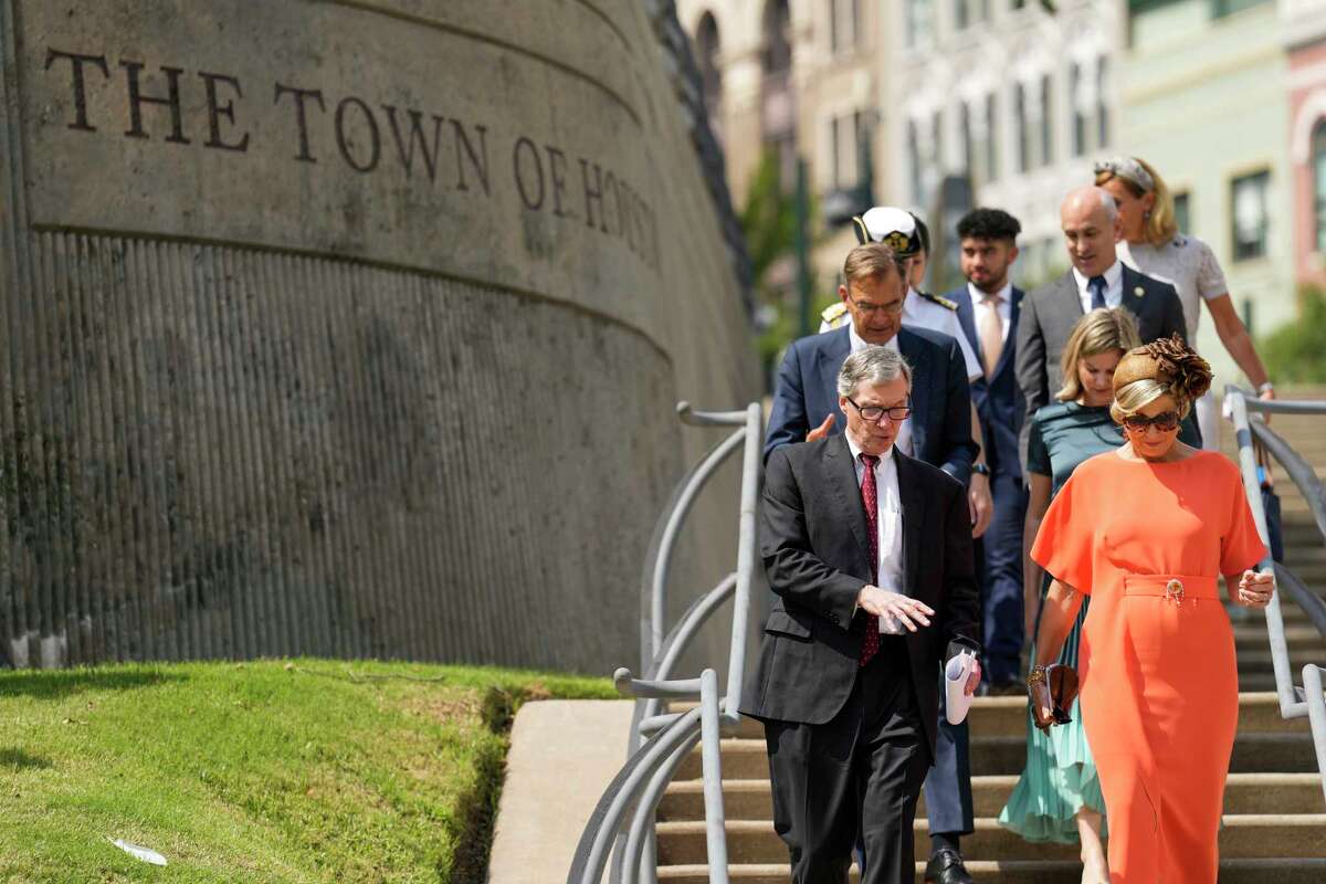 Steve Costello, chief recovery officer with the Mayor's Office, left, walks with Queen Maxima, of the Netherlands, at Allen's Landing to a boat ride along Buffalo Bayou Friday, Sept. 9, 2022 in Houston. (Brett Coomer/Houston Chronicle via AP)