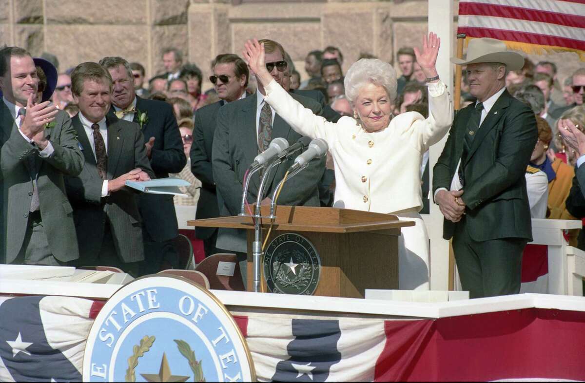 Ann Richards raises both arms in celebration after being sworn in as governor of Texas in Austin, Texas in this Jan. 15, 1991.
