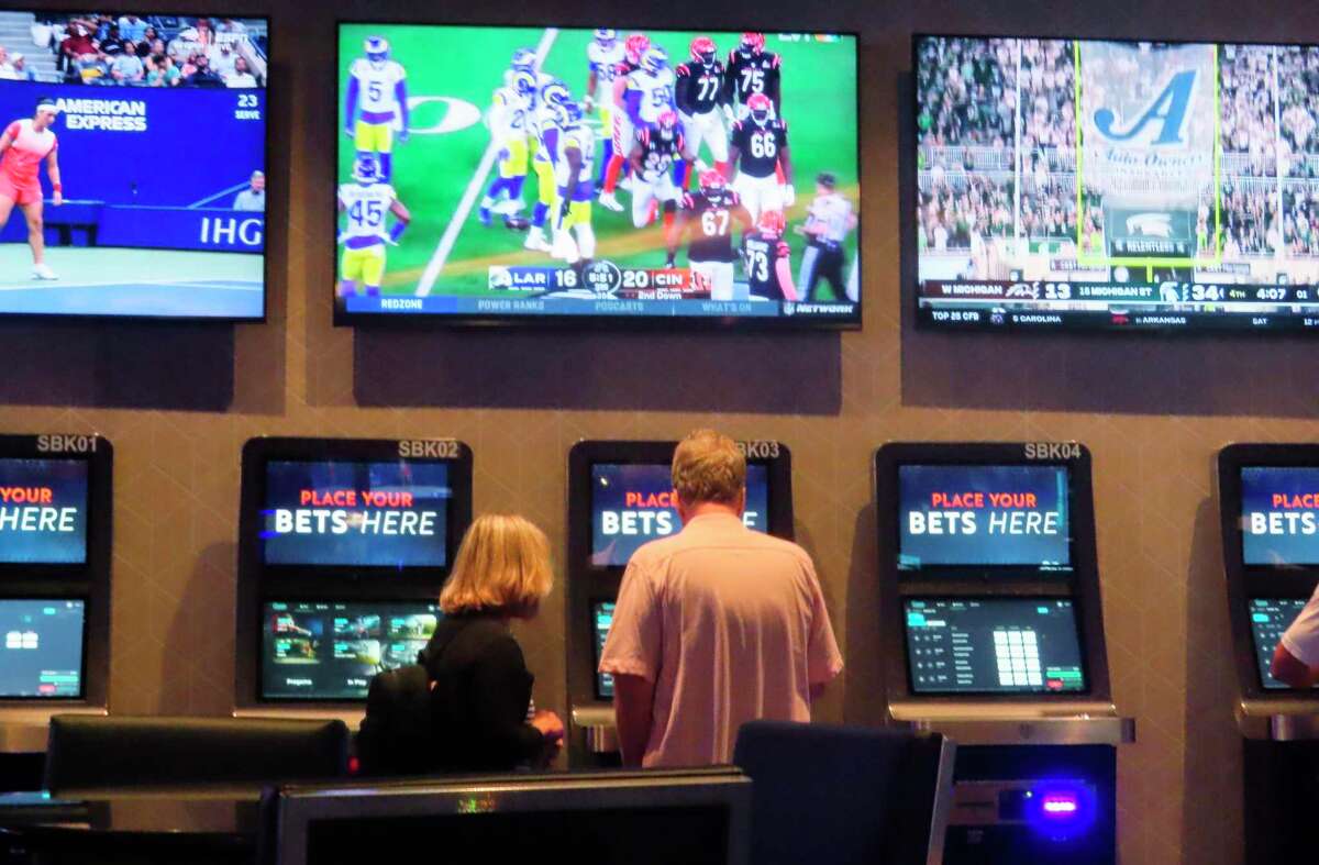 A customer makes a sports bet at the Ocean Casino Resort in Atlantic City, N.J. California voters are set to weigh in on how and whether to allow sports betting.