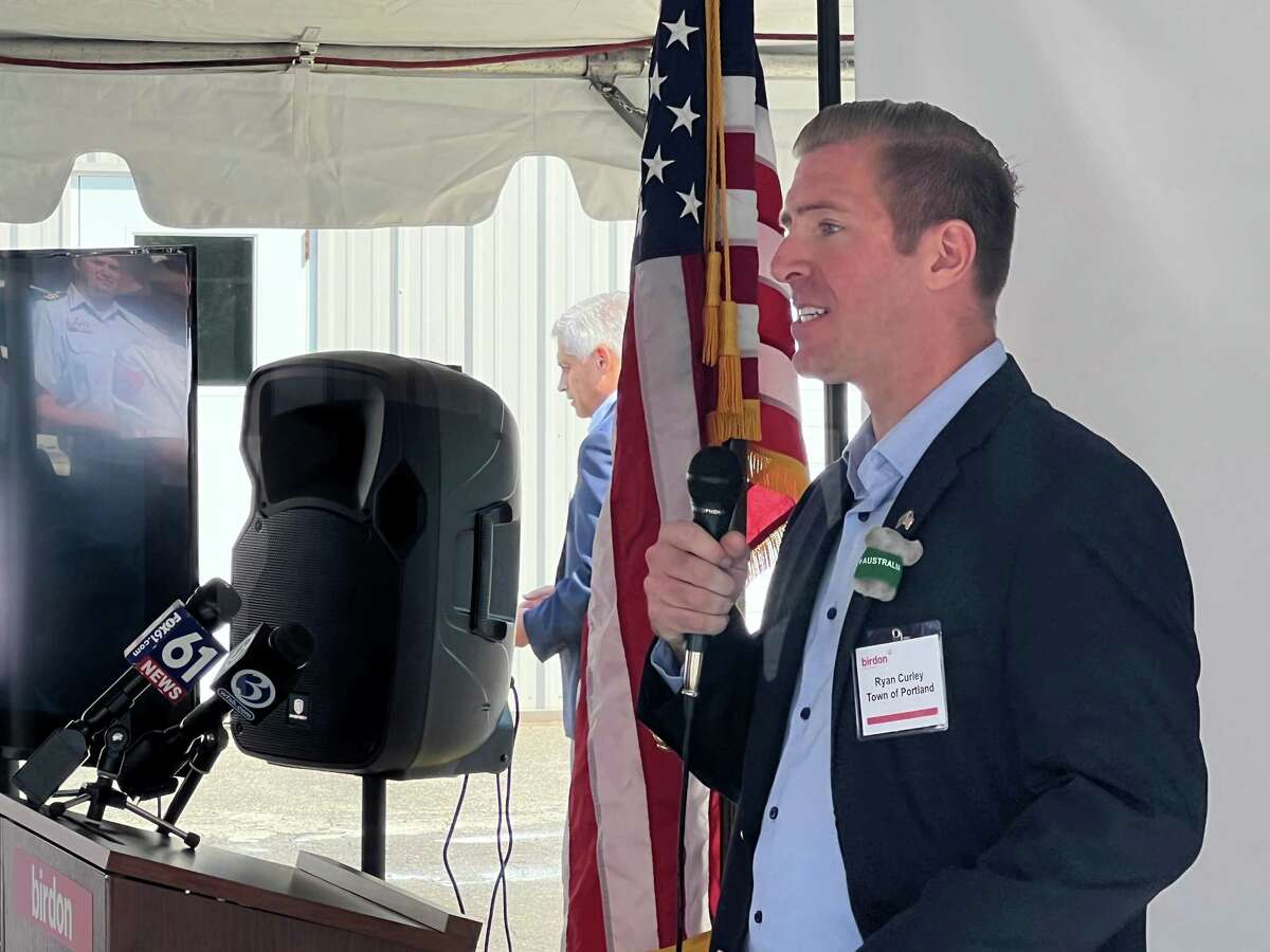 Ryan Curley, Portland's first selectman, speaks at an event Friday honoring the arrival of Birdon Group USA in town. The Australian company has a production facility along the Connecticut River in town where it will be refurbishing Coast Guard vessels.
