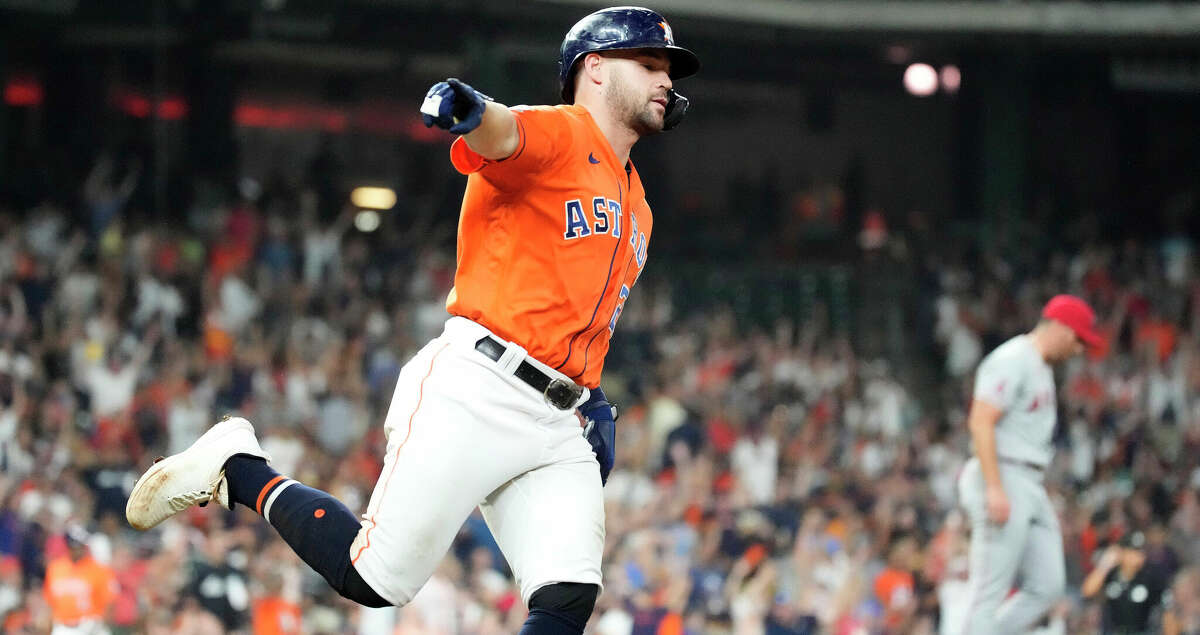 Houston Astros' Chas McCormick (20) points towards the Astros dugout after he hit a go-ahead home run against Los Angeles Angels relief pitcher Andrew Wantz during the seventh inning of an MLB baseball game at Minute Maid Park on Friday, Sept. 9, 2022 in Houston.