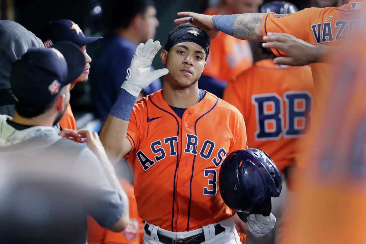 Houston Astros' Jeremy Pena (3) is congratulated in the dugout after his home run against the Los Angeles Angels during the sixth inning of a baseball game Friday, Sept. 9, 2022, in Houston.