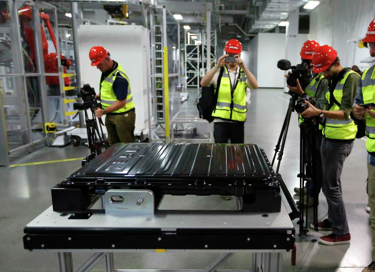 A Tesla battery pack is displayed during a media tour of the new Tesla Gigafactory in 2016, in Sparks, Nev., to produce the batteries. Interest in lithium has exploded in recent years because of its use in rechargeable batteries for electric and hybrid cars, lawnmowers, power tools and more. Lithium batteries also power laptops and cell phones.