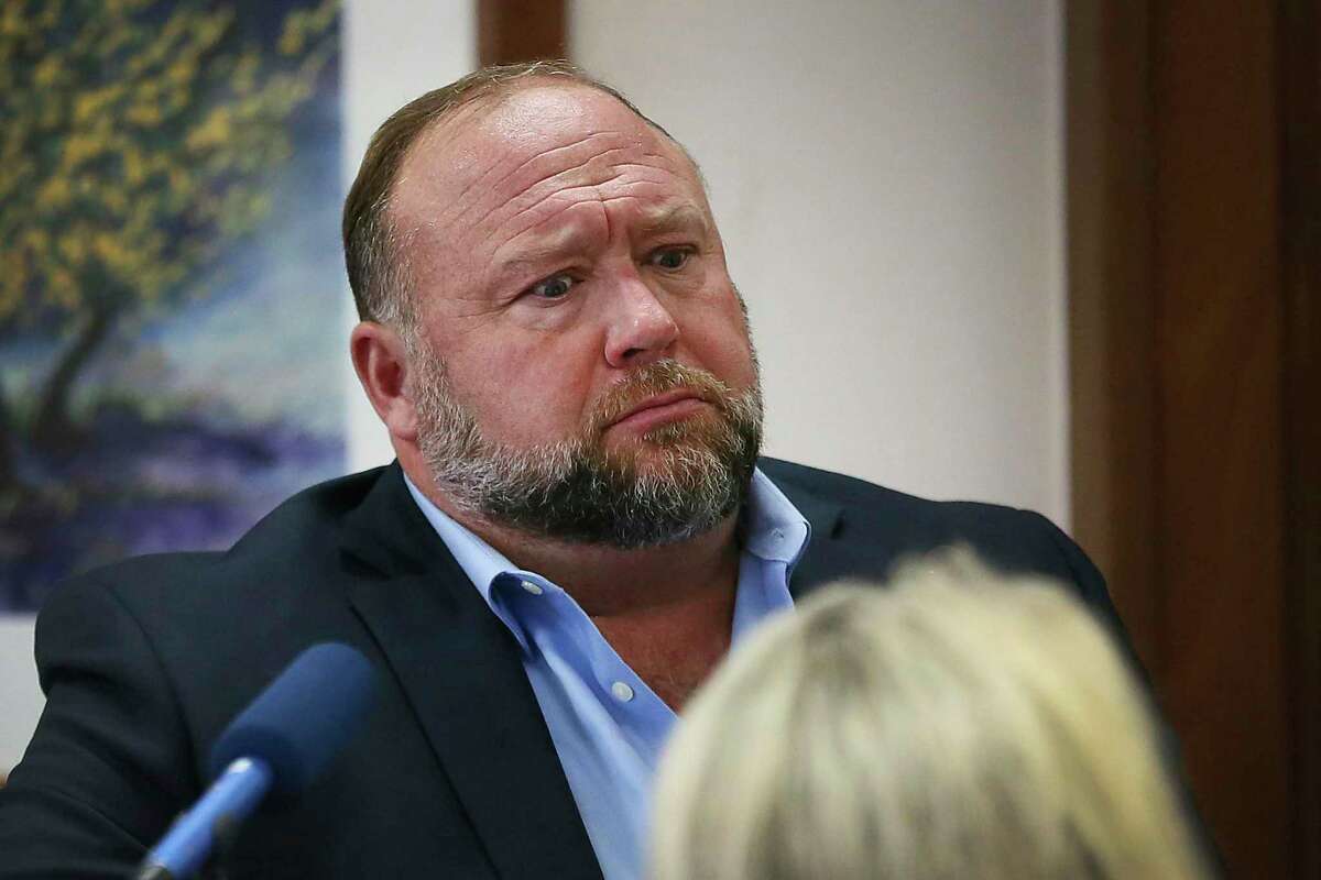 Conspiracy theorist Alex Jones testifies last month during trial at the Travis County Courthouse in Austin, Texas. On Tuesday, his trial will begin in Waterbury for a defamation lawsuit filed by Sandy Hook families.