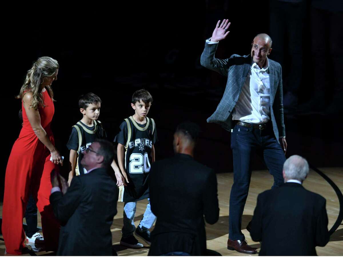 San Antonio Spurs legend Manu Ginobili, accompanied by his wife, Marianela Oroño, and twins, Dante and Nicola, enters the AT&T Center for his retirement ceremony on Thursday night, March 28, 2019. On Saturday, he was inducted into the Naismith Memorial Basketball Hall of Fame.