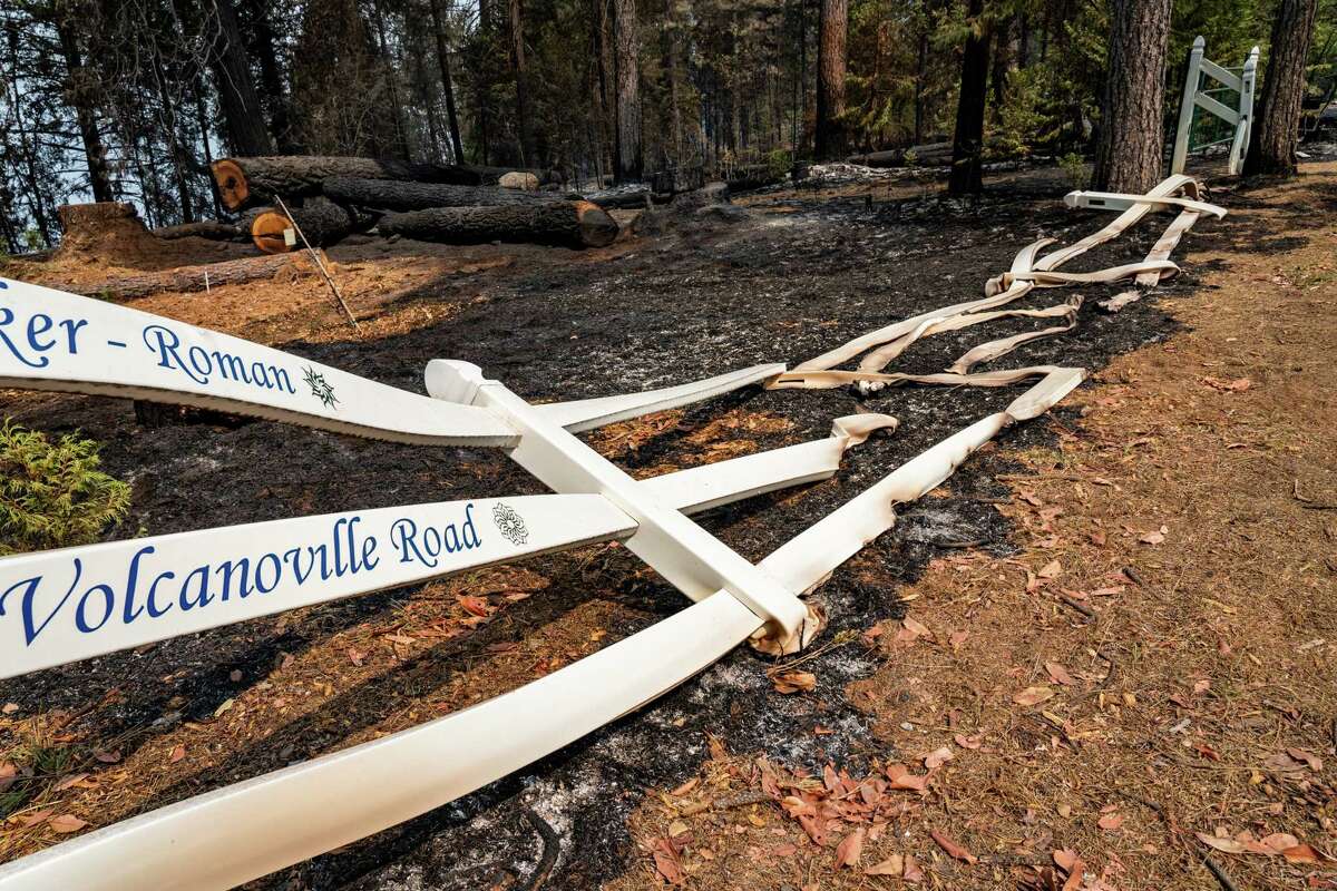 A burned fence after flames from the Mosquito Fire jumped the American River, burning structures in Volcanoville, Calif on Sept. 10, 2022. The fast-moving Mosquito Fire in the Sierra Nevada foothills doubled in size Friday to at least 46 square miles and threatened 3,600 homes, while blanketing the region in smoke.
