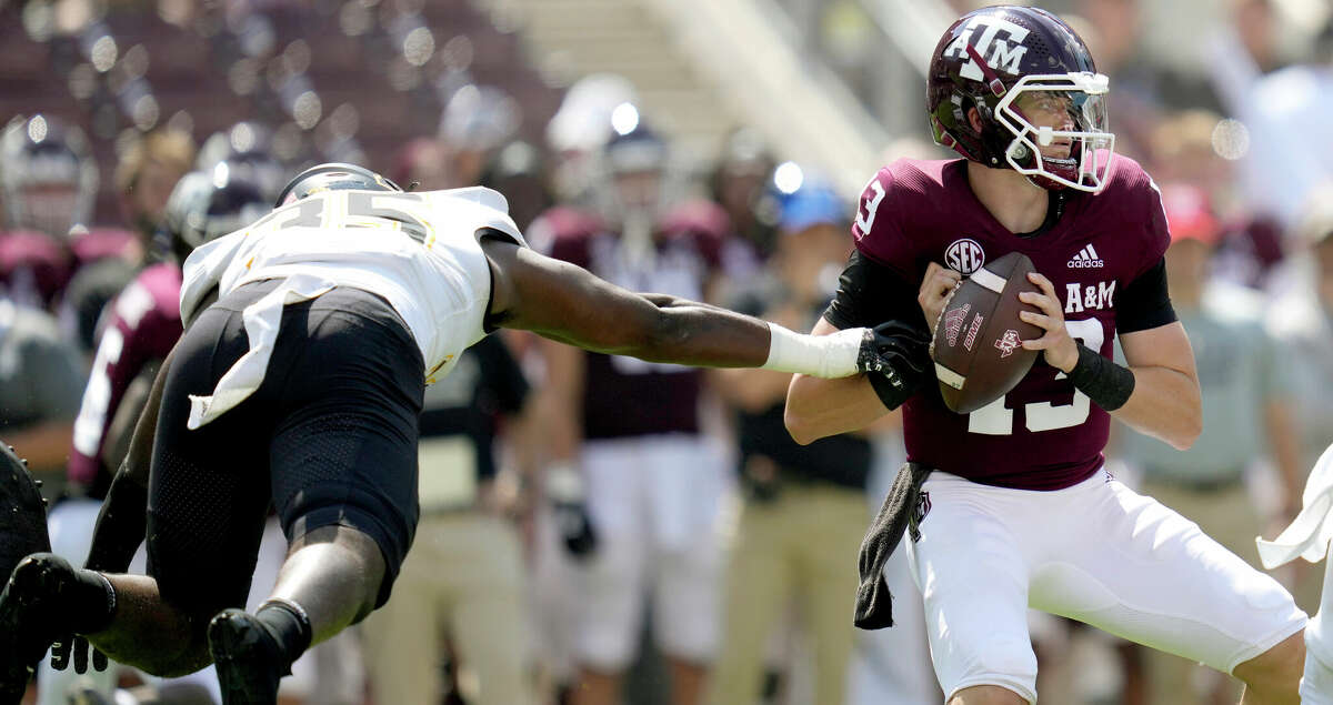 Appalachian State linebacker Jalen McLeod (35) knocks the ball away from Texas A&M quarterback Haynes King (13) to cause a turnover during the first quarter of an NCAA college football game Saturday, Sept. 10, 2022, in College Station, Texas. (AP Photo/Sam Craft)