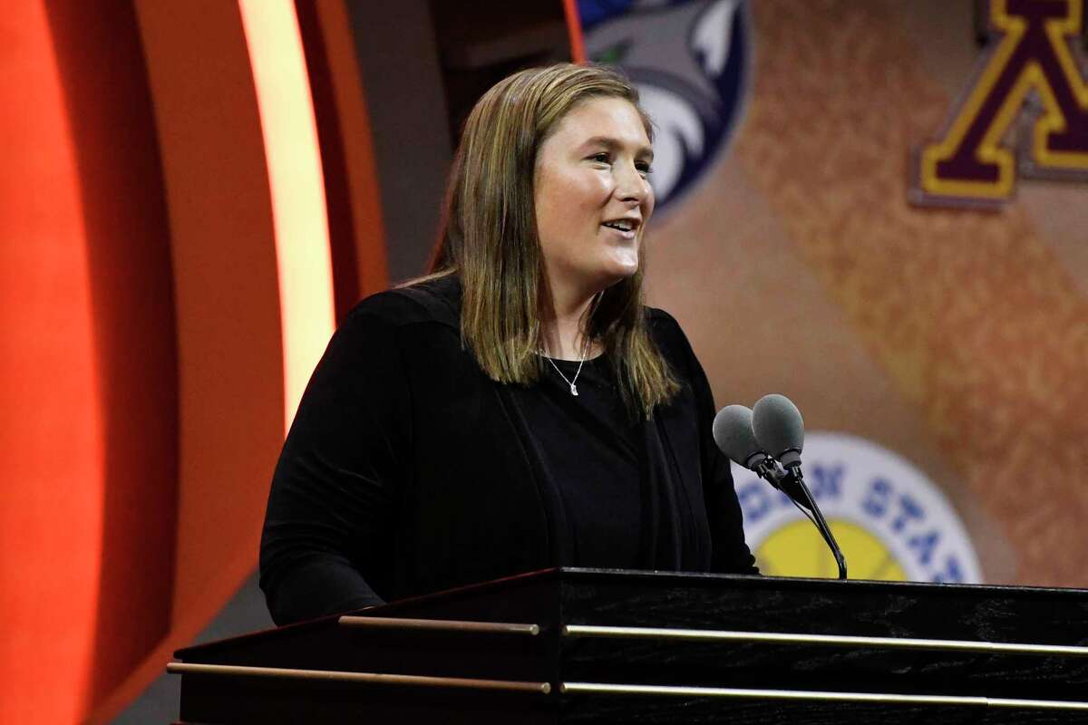 Lindsay Whalen addresses a gathering during her enshrinement ceremony for the Basketball Hall of Fame, Saturday, Sept. 10, 2022, in Springfield, Mass.