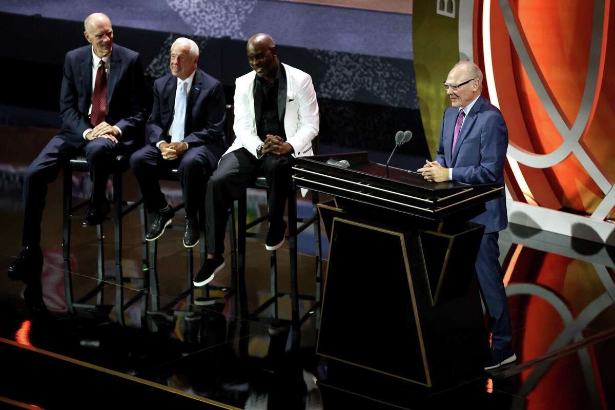 SPRINGFIELD, MASSACHUSETTS - SEPTEMBER 10: Naismith Memorial Basketball Hall of Fame Class of 2022 enshrinee George Karl speaks as Bobby Jones, Roy Williams and Gary Payton look on during the 2022 Basketball Hall of Fame Enshrinement Ceremony at Symphony Hall on September 10, 2022 in Springfield, Massachusetts. (Photo by Maddie Meyer/Getty Images)
