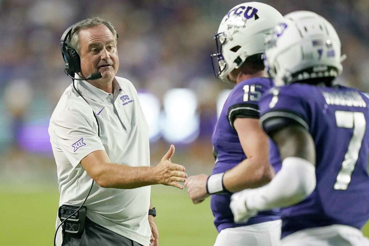 TCU head coach Sonny Dykes, left, congratulates quarterback Max Duggan (15) after a touchdown during the first half of an NCAA college football game against Tarleton State in Fort Worth, Texas, Saturday, Sept. 10, 2022.