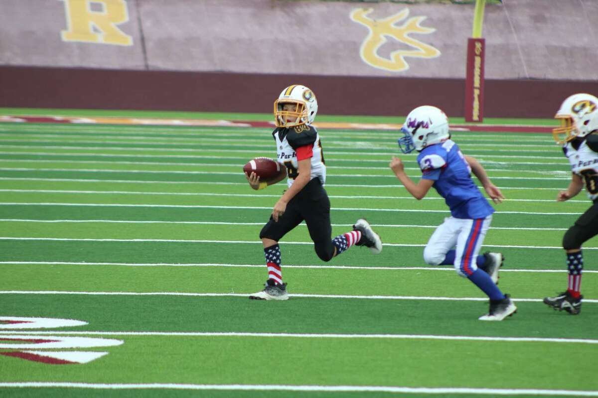 Junior Tiger Ajay Beard finds running room on the outside during a day in which he scored twice in the 42-0 win.