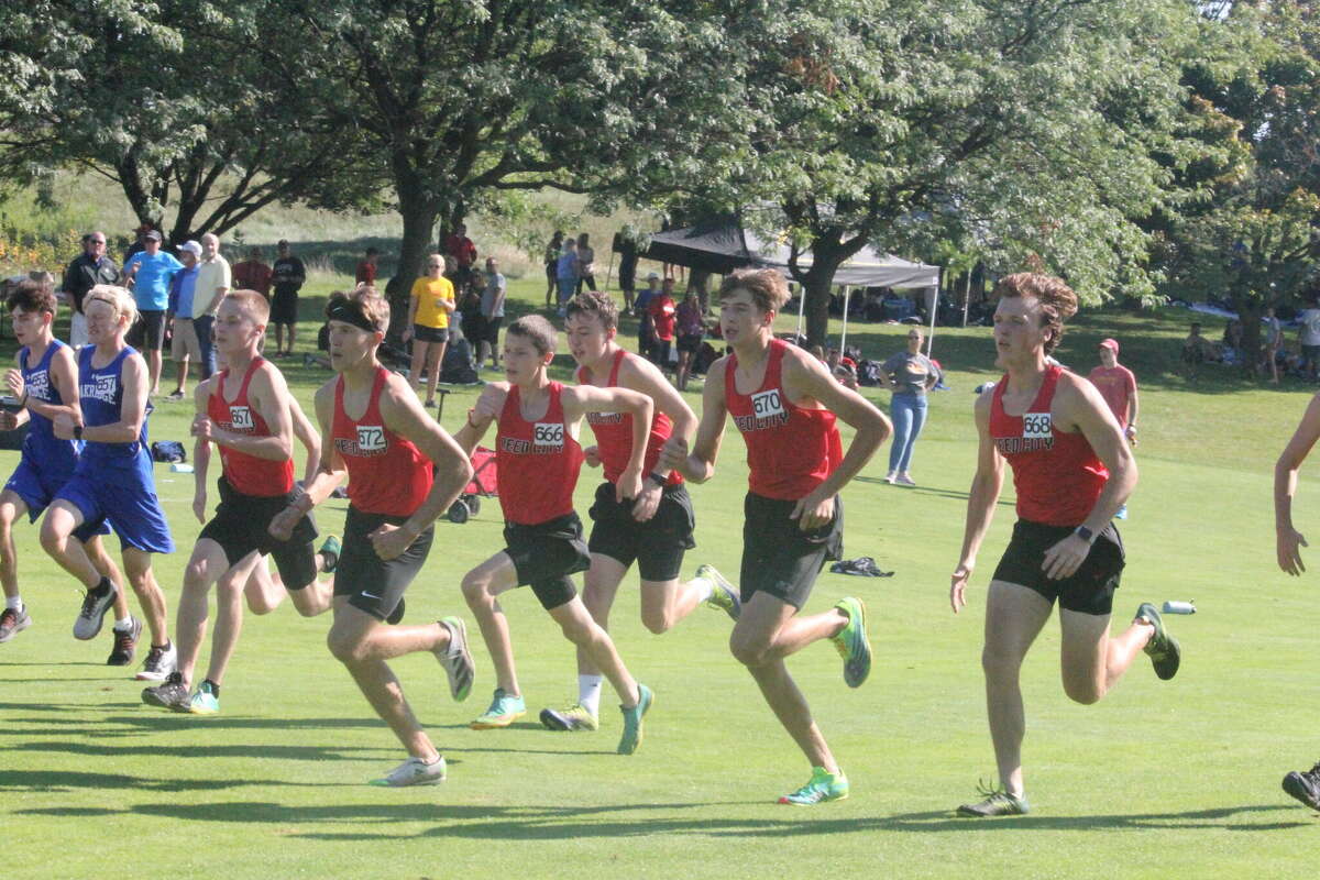 Reed City cross country runners head out from the start of the Ray Helsing Invitational on Saturday.