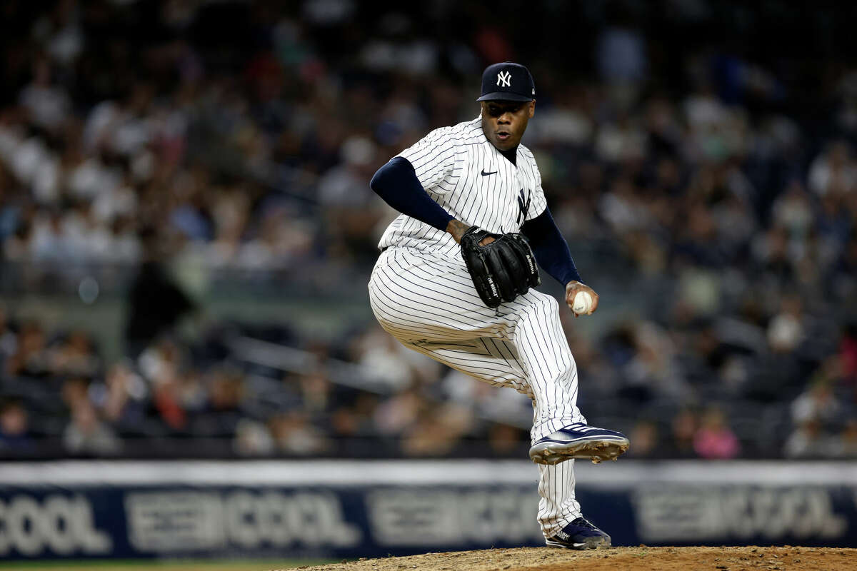 New York Yankees pitcher Aroldis Chapman (54) throws during the ninth inning of the team's baseball game against the Toronto Blue Jays on Friday, Aug. 19, 2022, in New York. The Blue Jays won 4-0. (AP Photo/Adam Hunger)