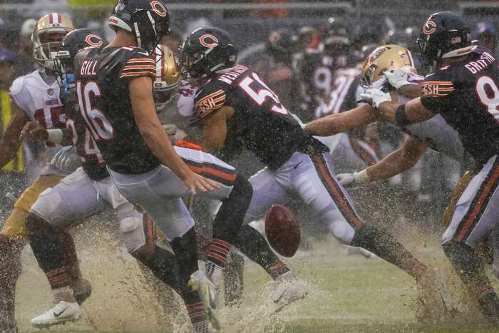 Heavy rain floods Soldier Field during Chicago Bears' season opener against  San Francisco 49ers