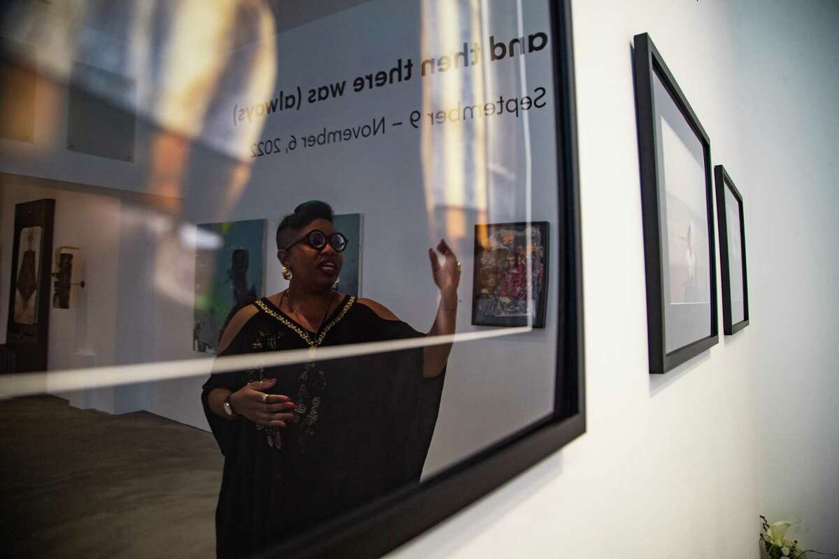 Art is Bond owner Janice Bond goes over artwork currently displayed as part of an exhibition titled “...and then there was (always),” which pays homage to the legacy of Black art both in Houston and around the world, Sunday, Sept. 11, 2022, in Houston.