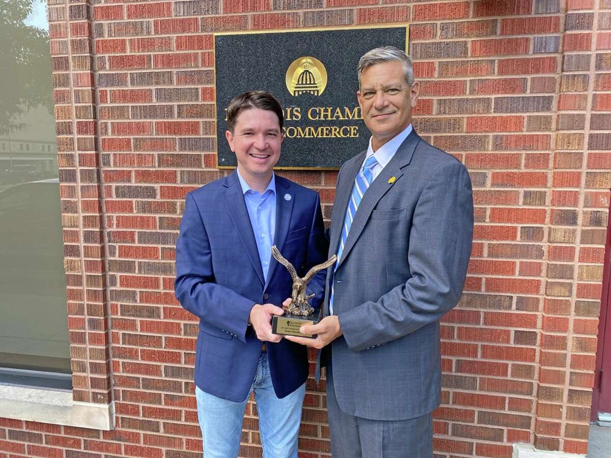 State Sen. Steve McClure (left) accepts the Champion of Free Enterprise award from Illinois Chamber of Commerce President Todd Maisch.