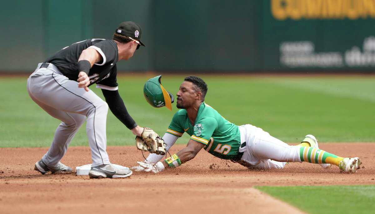 The A’s Tony Kemp, diving safely into second, scored four runs and drove in three in the win.