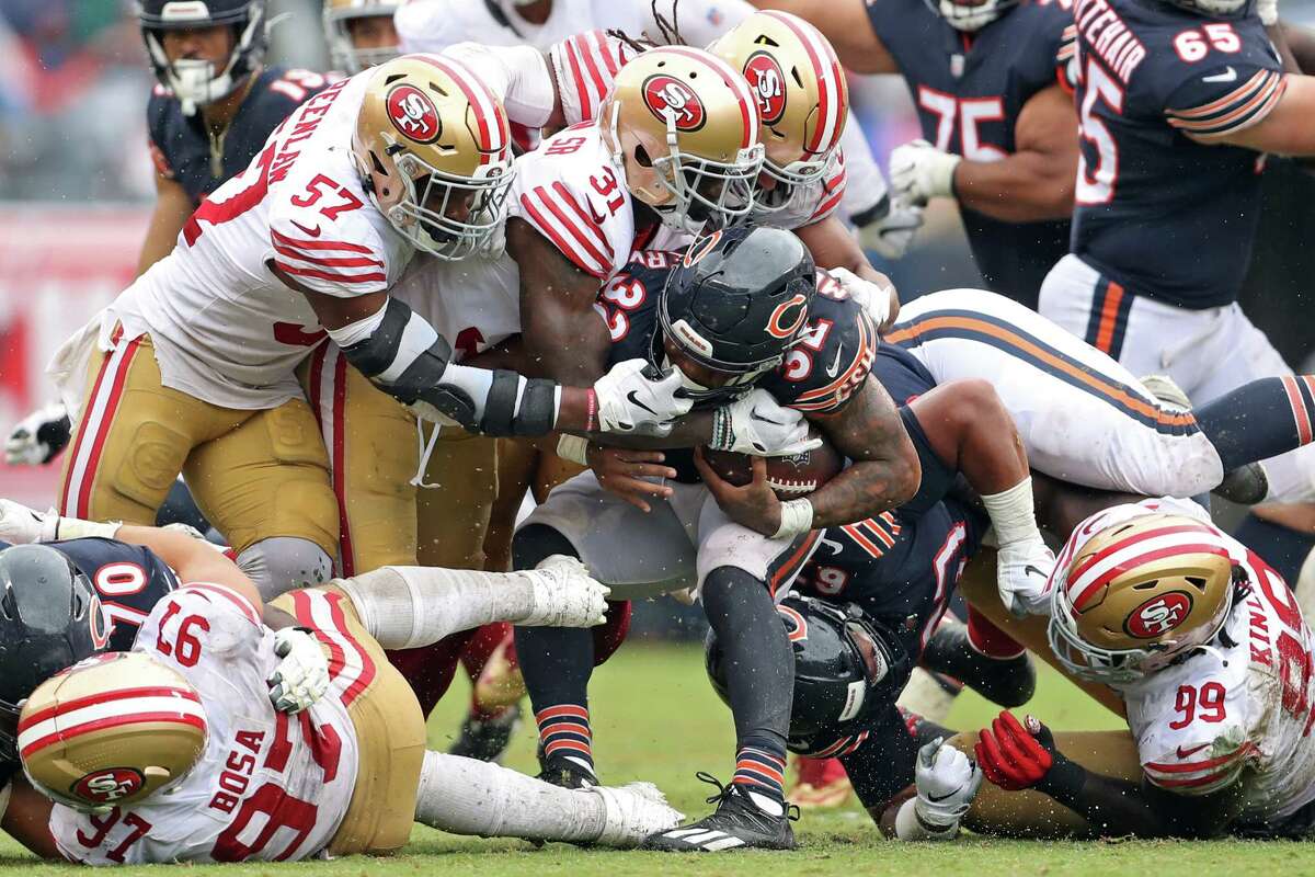 San Francisco 49ers’ Dre Greenlaw commits a face masking penalty against Chicago Bears’ David Montgomery in 3rd quarter of Niners’ 19-10 loss during NFL game at Soldier Field in Chicago, IL, on Sunday, September 11, 2022.