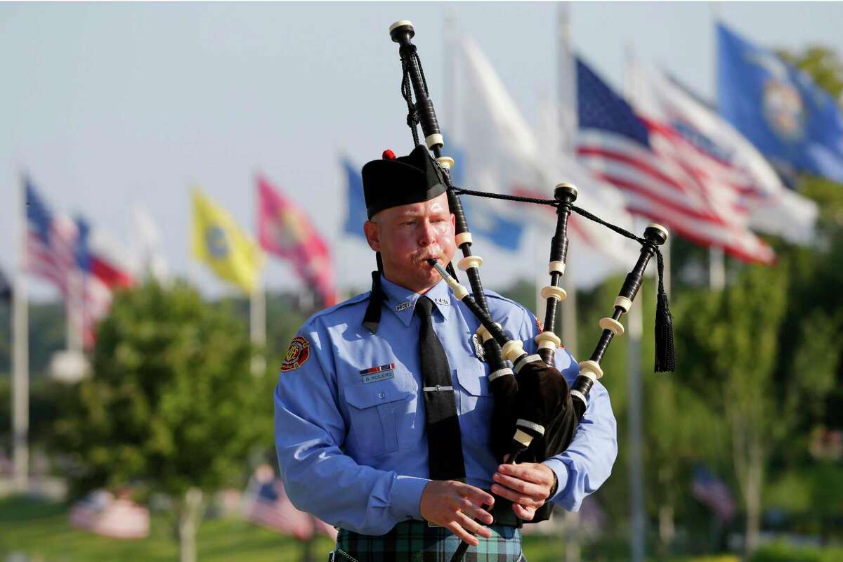 Brandon Keilers plays “Amazing Grace” on bagpipes during a September 11th Observance ceremony on the 21st anniversary of the 9/11 attacks, held at the Montgomery County Veterans Memorial Park Sunday in Conroe.