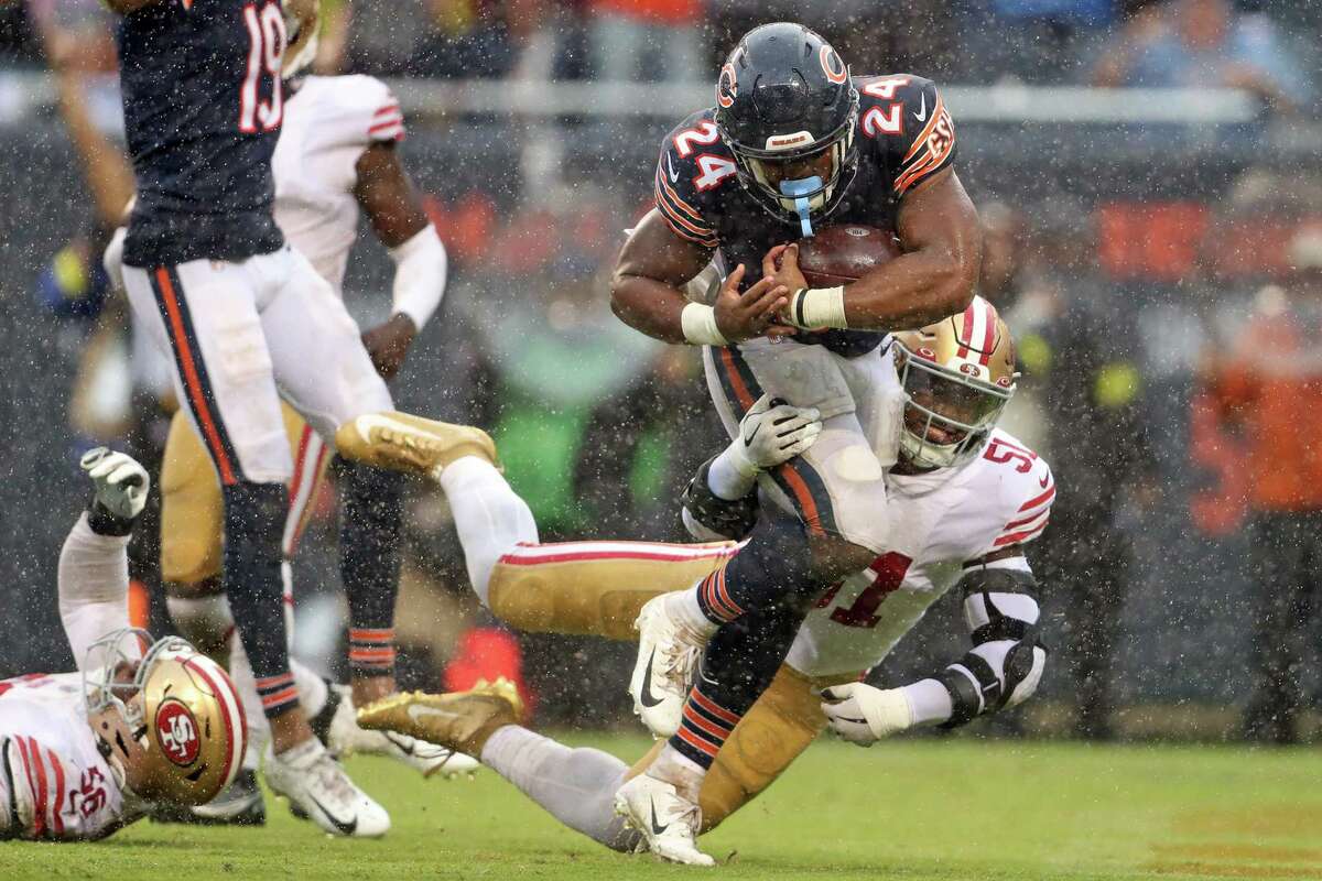 Chicago Bears’ Khalil Herbert runs past San Francisco 49ers’ Azeez Al-Shaair during a 4th quarter touchdown run during Niners’ 19-10 loss during NFL game at Soldier Field in Chicago, IL, on Sunday, September 11, 2022.