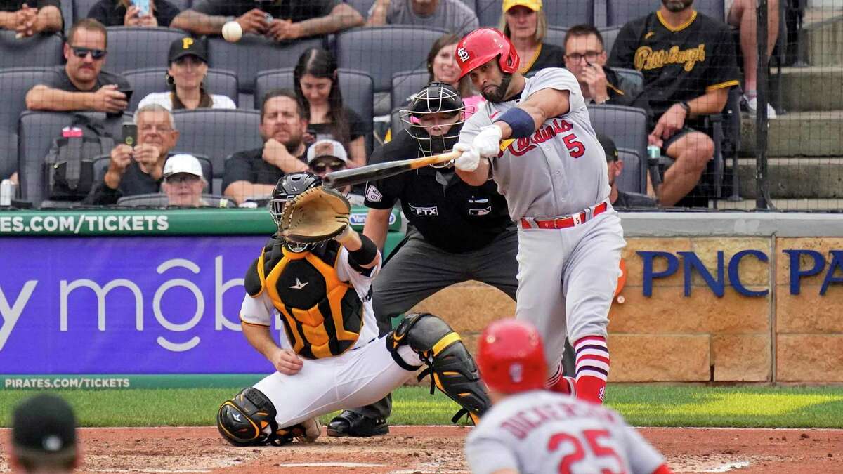 St. Louis Cardinals' Albert Pujols (5) hits a two-run home run off Pittsburgh Pirates relief pitcher Chase De Jong during the ninth inning of a baseball game in Pittsburgh, Sunday, Sept. 11, 2022. (AP Photo/Gene J. Puskar)