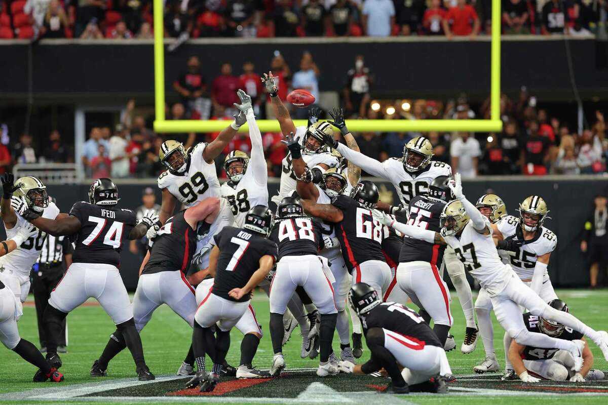 Defensive end Payton Turner (98) of the New Orleans Saints blocks a game winning field goal attempt by place kicker Younghoe Koo of the Atlanta Falcons during the fourth quarter on Sunday.