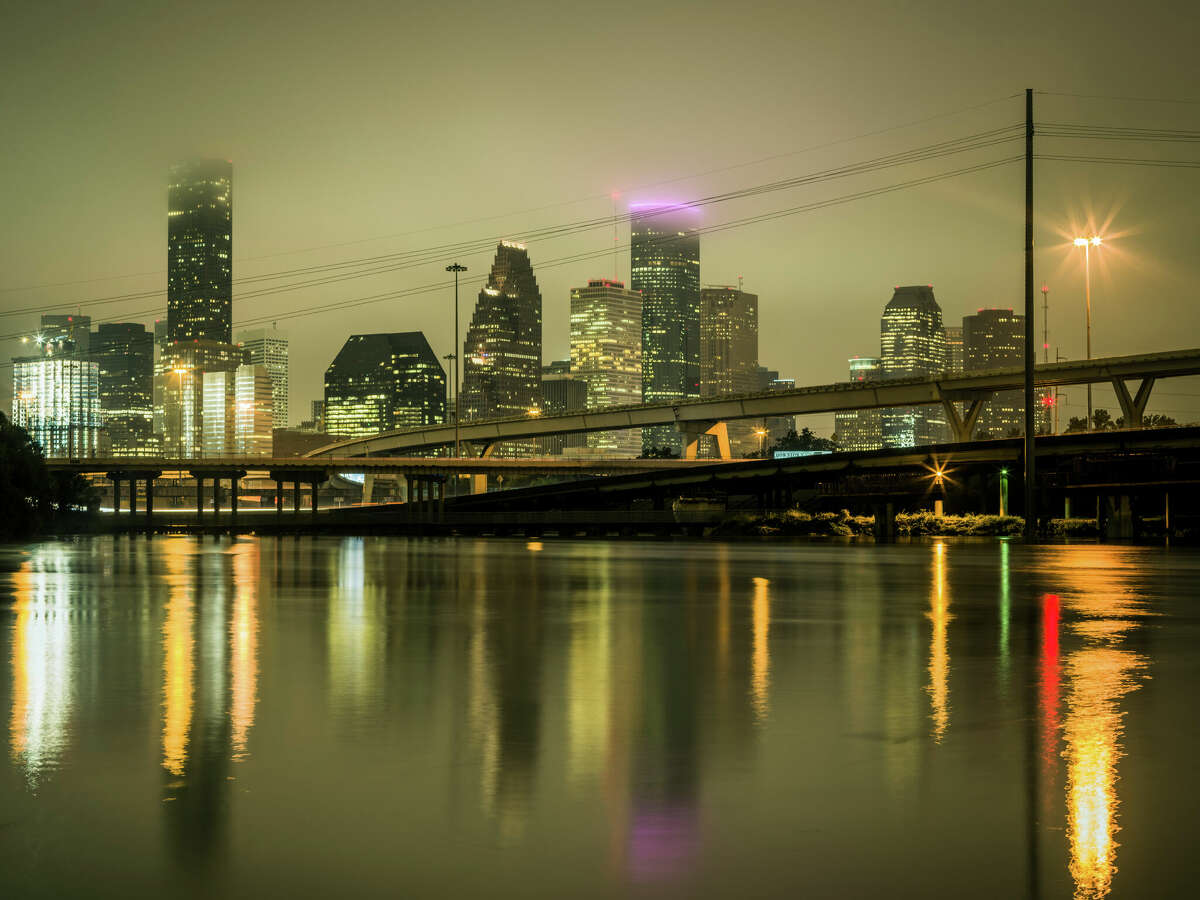 FILE PHOTO Downtown Houston flooding at night, Texas, USA.