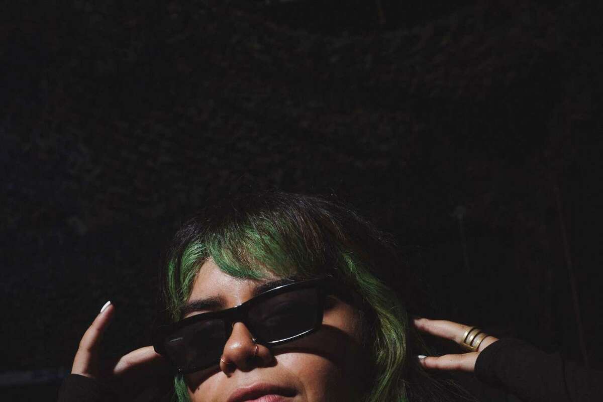 Quetzal, age 25. Underground rave in Richmond, CA.