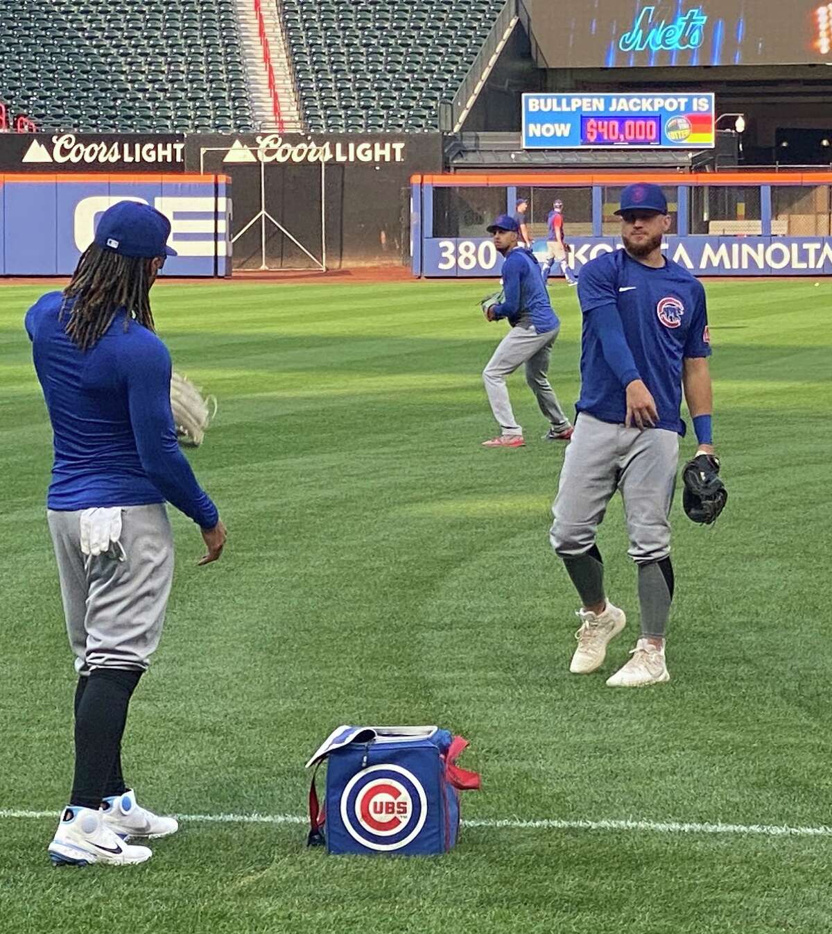 Wallingford's P.J. Higgins (right) plays catch with a Chicago Cubs teammate prior to a game against the Mets on Monday night at Citi Field.