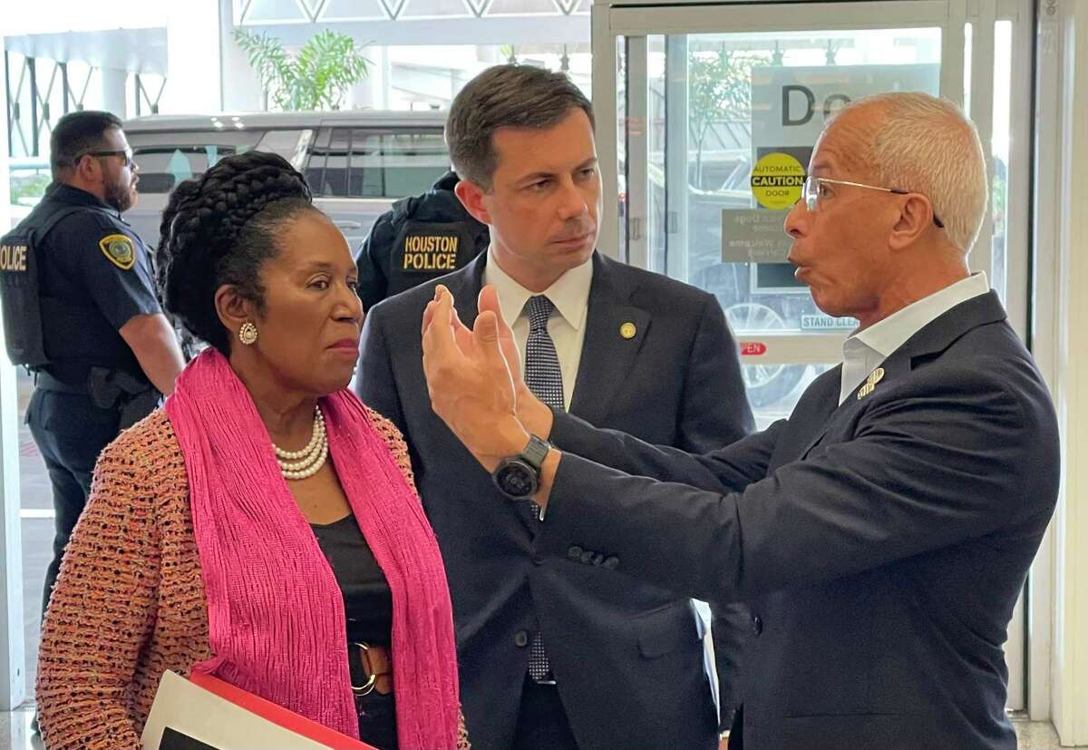 Houston Airport System Director Mario Diaz, right, explains planned improvements to Bush Intercontinental Airport to Transportation Secretary Pete Buttigieg, center and U.S. Rep. Sheila Jackson-Lee, D-Houston, during a brief tour of Terminal A on Sept. 12, 2022.