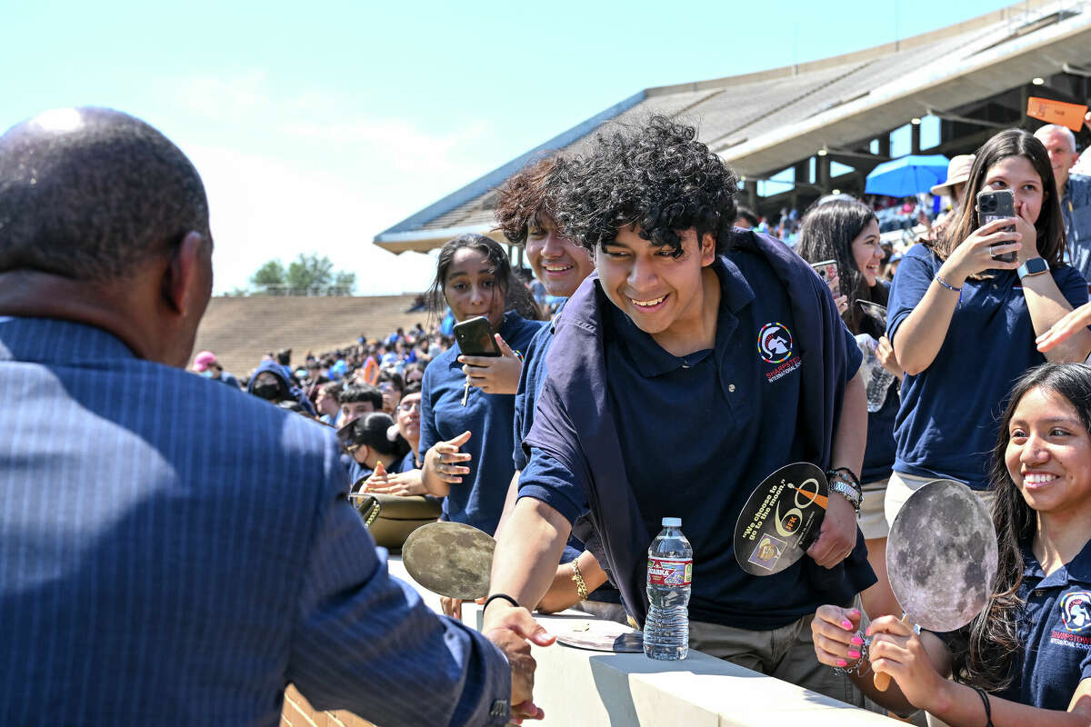 September 12, 2022; Houston, Texas: Sylvester Turner, Mayor of Houston shakes hands with Jamie Juarez a student at Sharpstown International School after he spoke at the 60th anniversary commemoration of JFK's moon speech at Rice Stadium on the campus of Rice University.