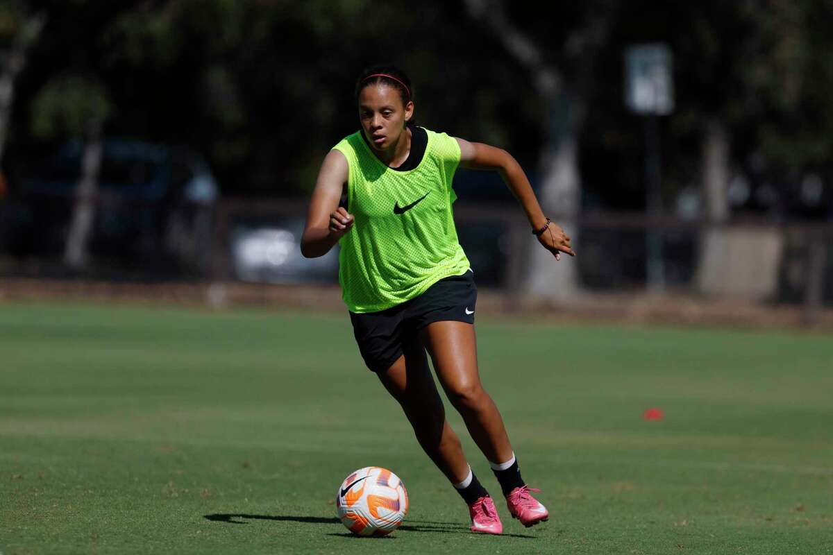 Stanford's Jasmine Aikey (12) moves the ball down the field during soccer practice at the Maloney Field on the campus at Stanford, Calif., on Tuesday, August 16, 2022.