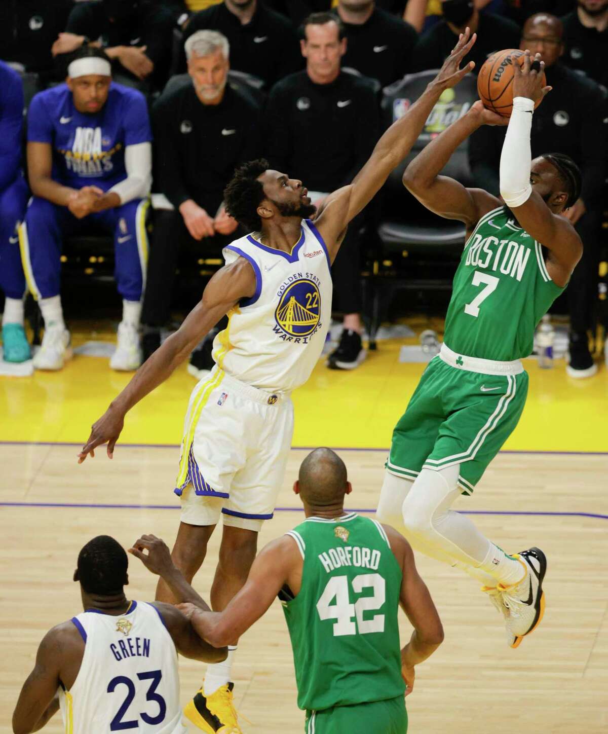 Golden State Warriors' Andrew Wiggins, 22, defends against Boston Celtics' Jaylen Brown, 7, during the second quarter of the NBA Finals at Chase Center in San Francisco, Calif., on Thursday, June 2, 2022.