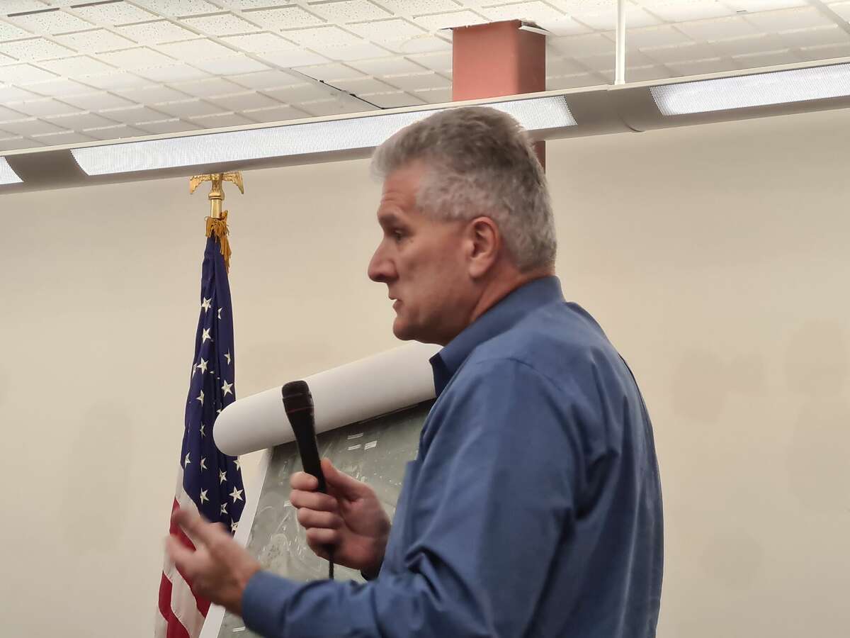 Sal Filardi, Quinnipiac University's vice president for facilities and capital planning, addresses concerns from neighbors during a zoning meeting at Memorial Library in North Haven Sept. 12, 2022.