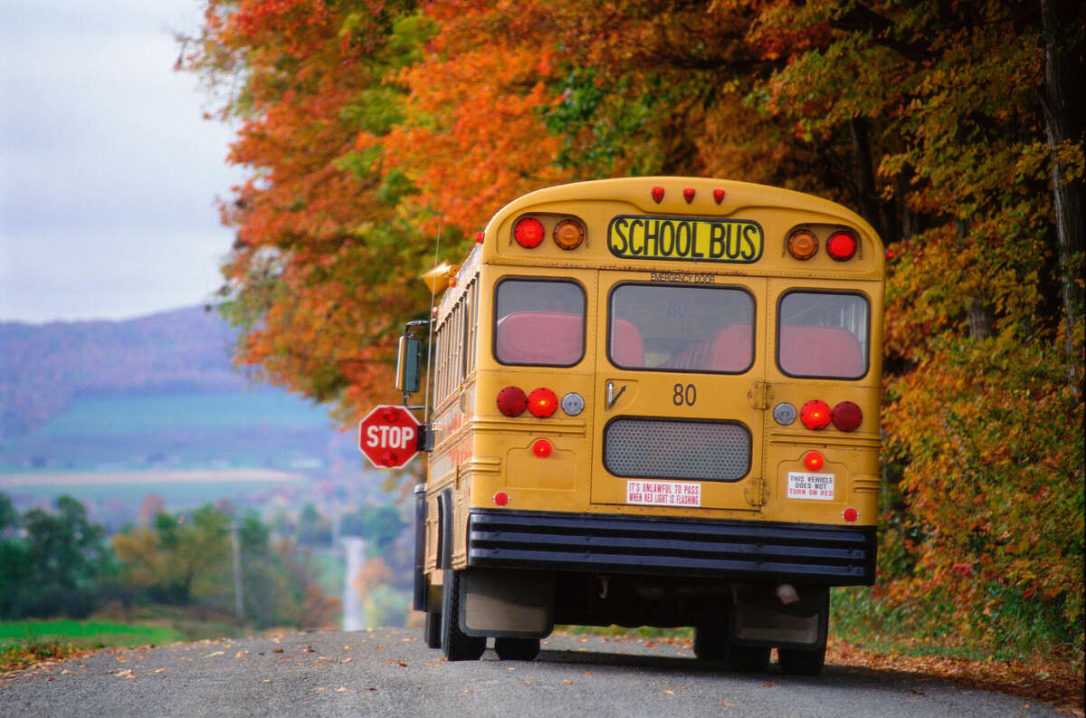STOCK IMAGE School bus drives down a road