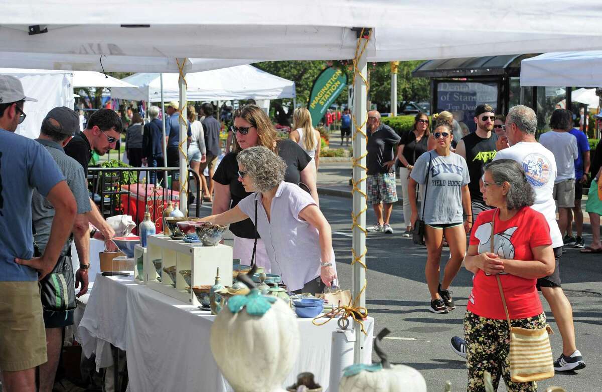 The annual Arts & Crafts on Bedford event on Bedford Street in downtown Stamford, Conn., on Saturday September 10, 2022. Arts & Crafts on Bedford brings juried artisans from throughout the Northeast who will display and sell juried works including ceramics, fiber arts, fine art, jewelry, metal, photography, painting, wood and more. Arts & Crafts on Bedford is presented by Stamford Downtown Special Services District and sponsored by 95.9 The Fox, Star 99.9, WEBE 108 and Happyhaha.com Photography.