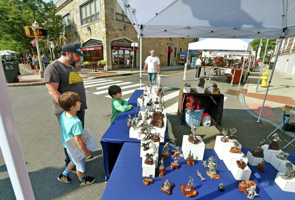 The annual Arts & Crafts on Bedford event on Bedford Street in downtown Stamford, Conn., on Saturday September 10, 2022. Arts & Crafts on Bedford brings juried artisans from throughout the Northeast who will display and sell juried works including ceramics, fiber arts, fine art, jewelry, metal, photography, painting, wood and more. Arts & Crafts on Bedford is presented by Stamford Downtown Special Services District and sponsored by 95.9 The Fox, Star 99.9, WEBE 108 and Happyhaha.com Photography.